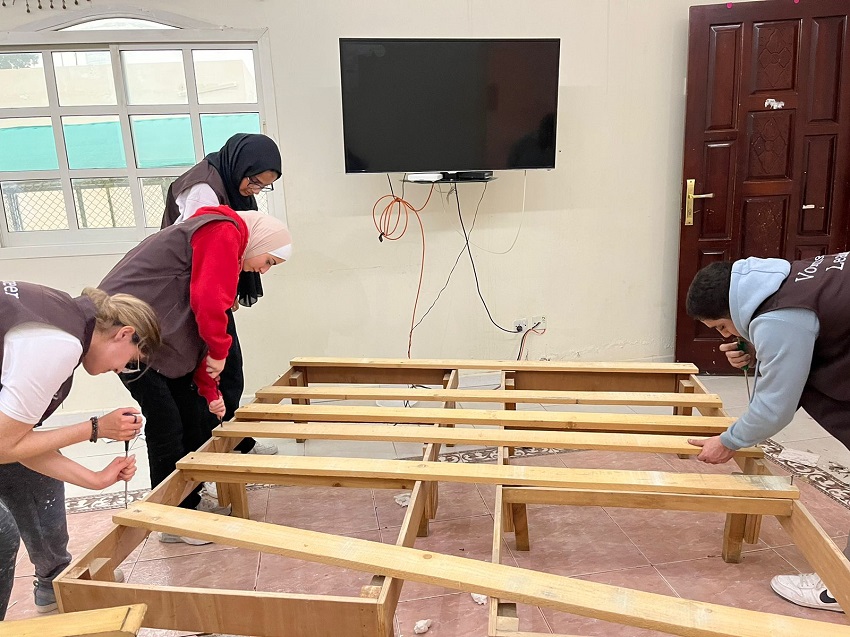 University students under a community service program rebuild a house for a needy family in Sharjah