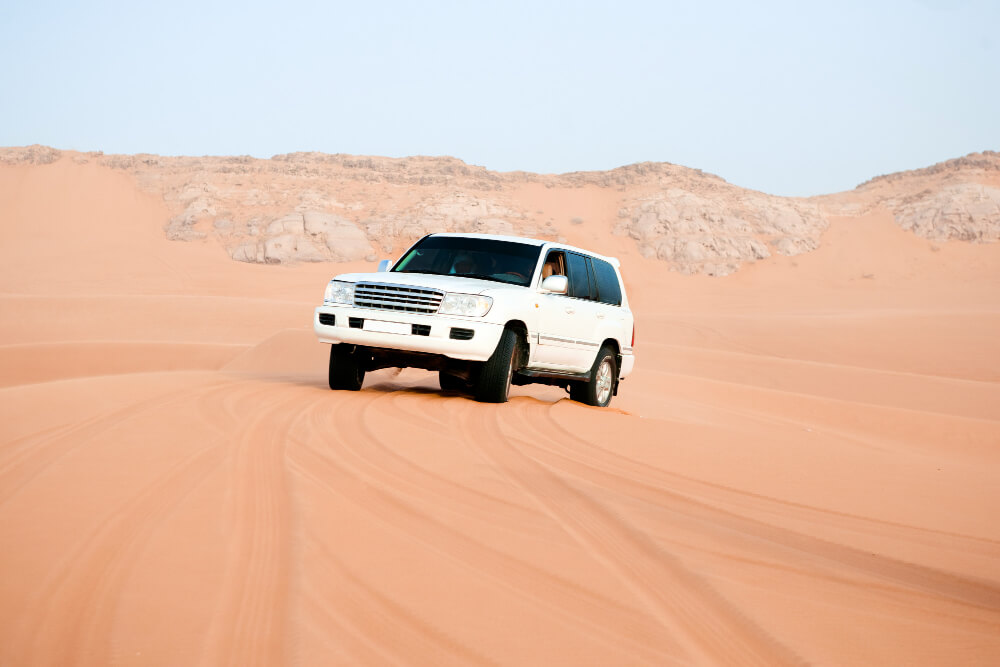 White 4x4 surfing in the Dessert