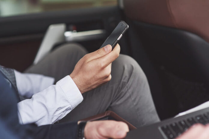 Man using his phone in the car