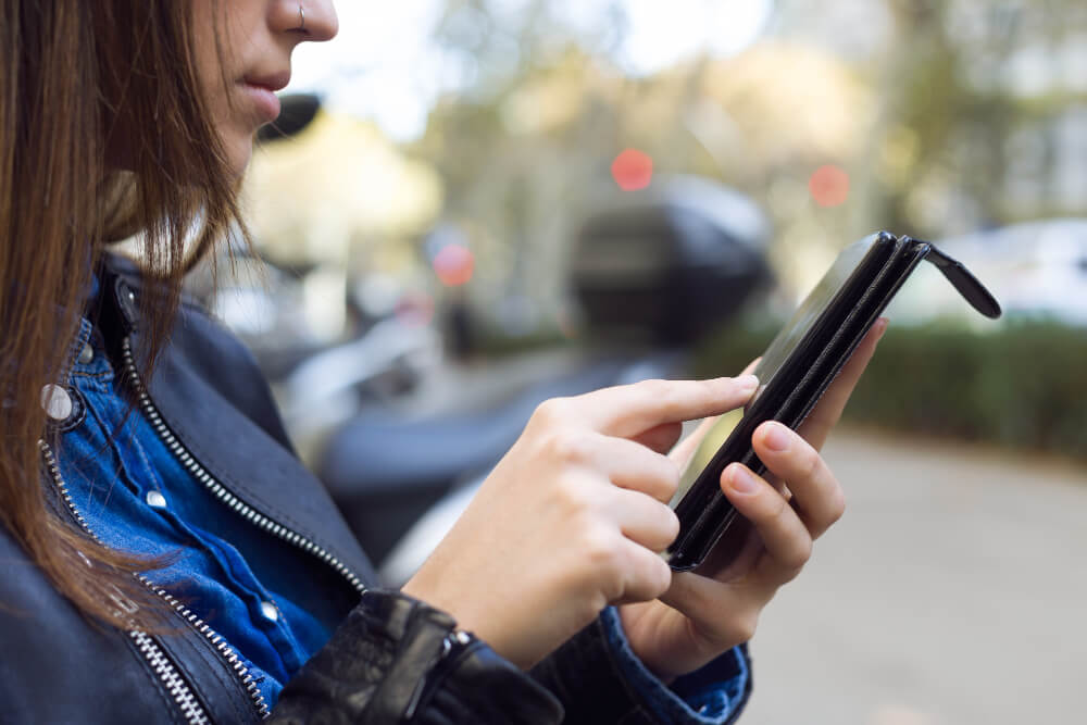 Woman using her phone to report a crime